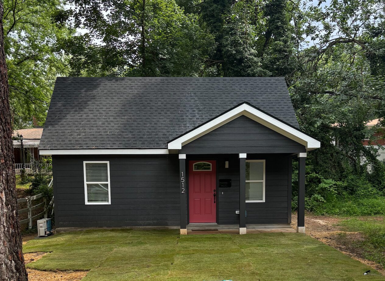 Battery ADU exterior with a red front door