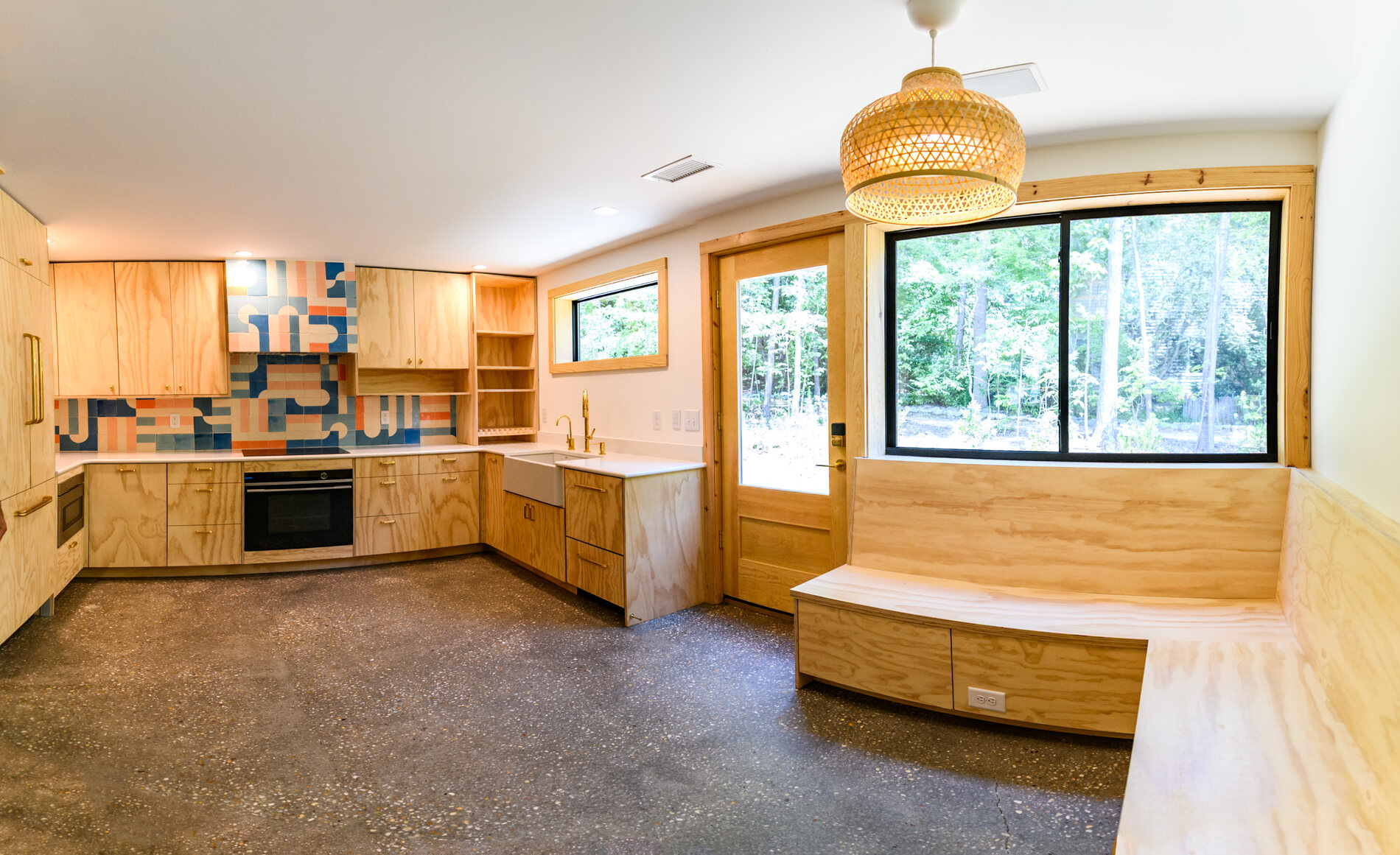 Custom kitchen with a built in window seat at Solterra Way